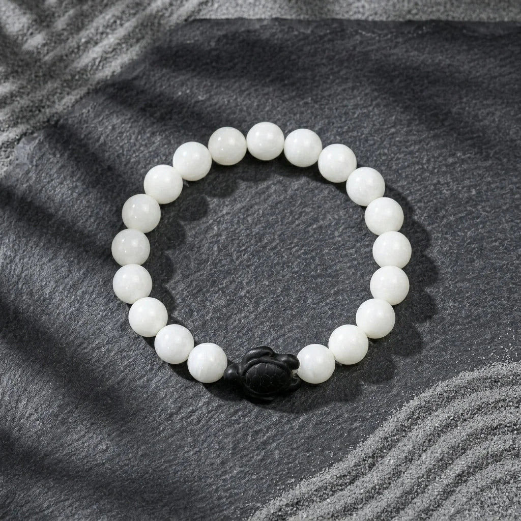 White Stone Bracelet With Turtle Charm Design